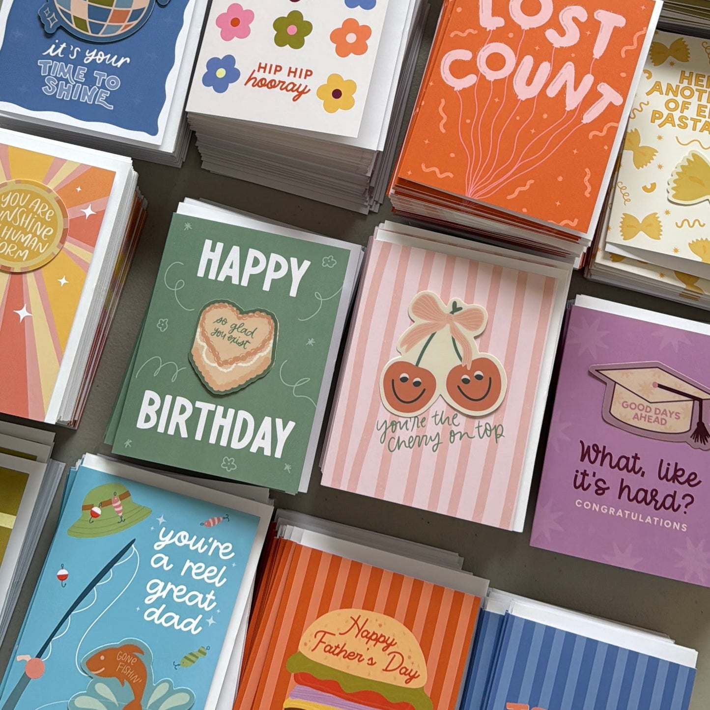 Collection of colorful greeting cards with various designs and text.