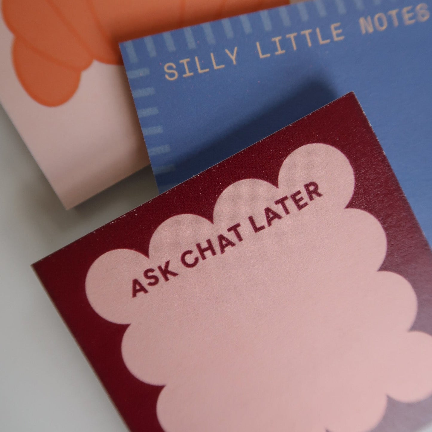 Notebook with 'Silly Little Notes' and a pink cloud-shaped note with 'Ask Chat Later'.
