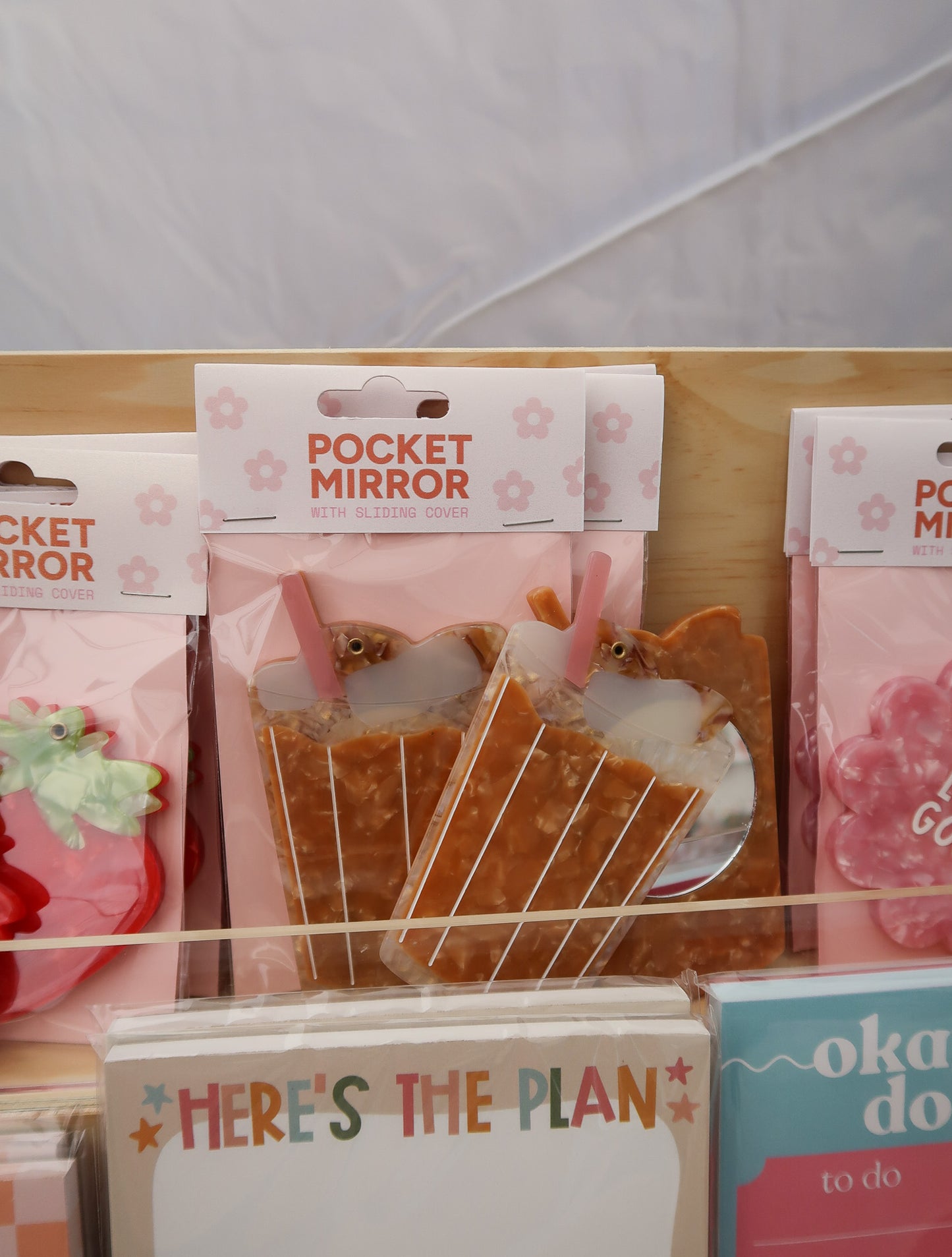Pocket mirrors with packaging on a display rack